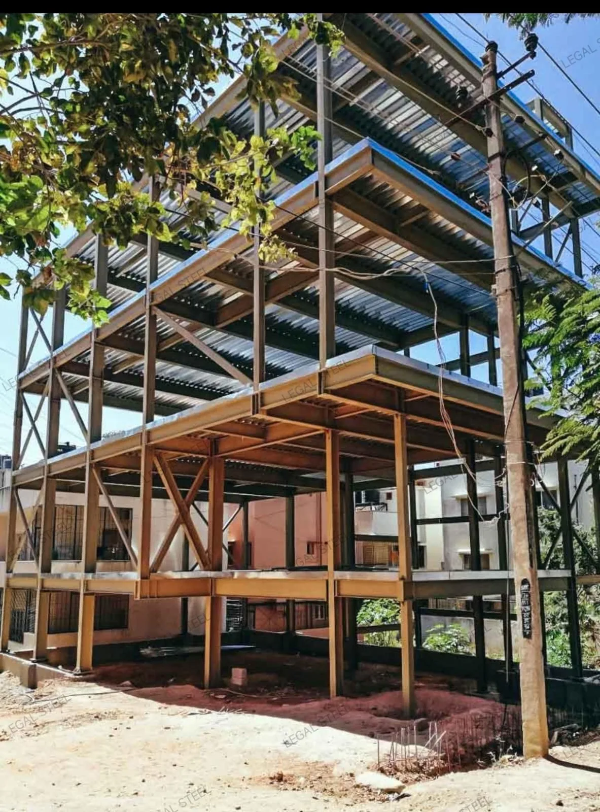 Multi-storey steel structure with metal floor decking under construction